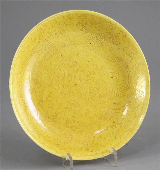A Chinese sgraffito yellow glazed dragon dish